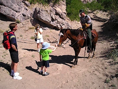 NPS ranger talks with park visitors
